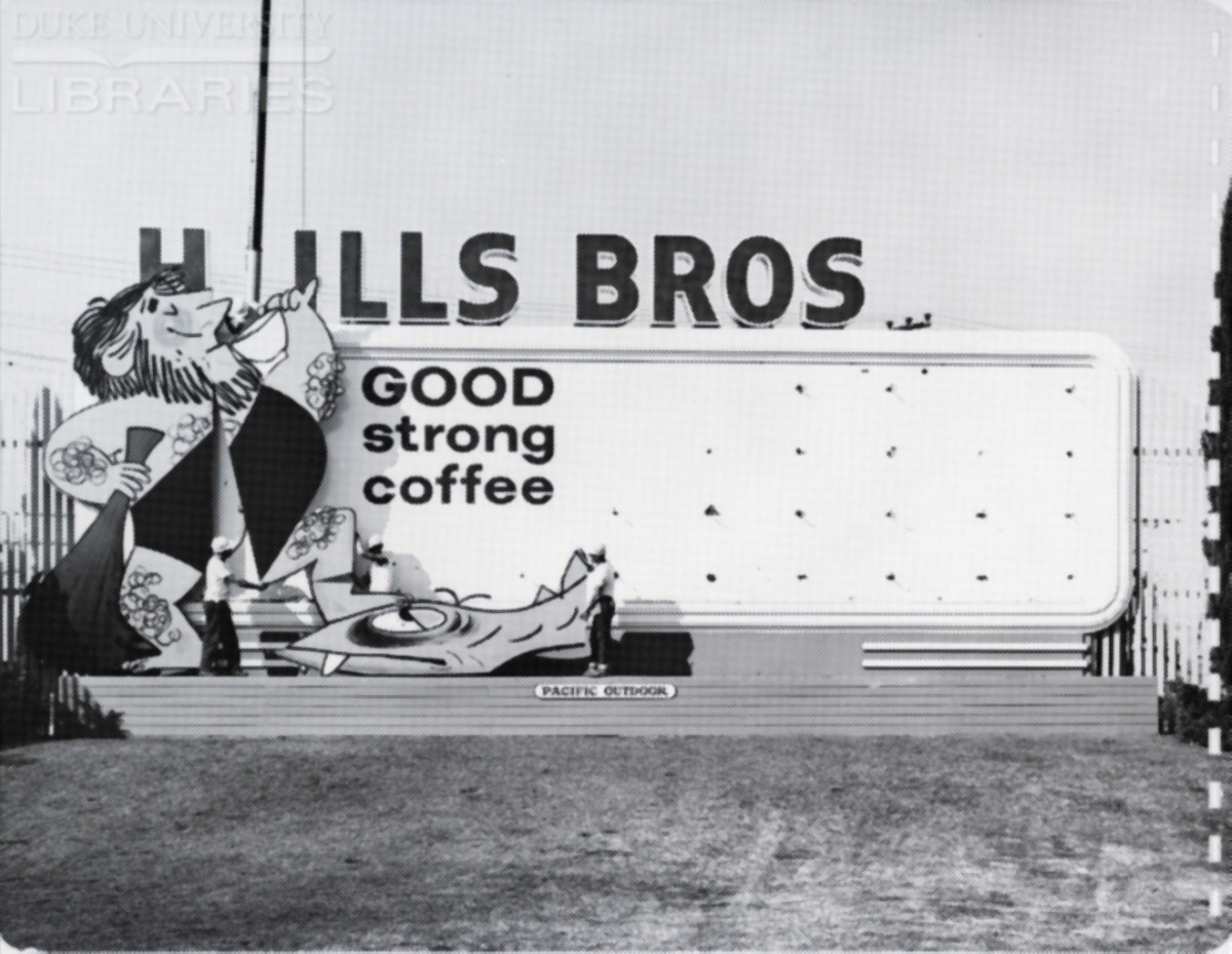 An installation crew places and fastens cutouts to a billboard.