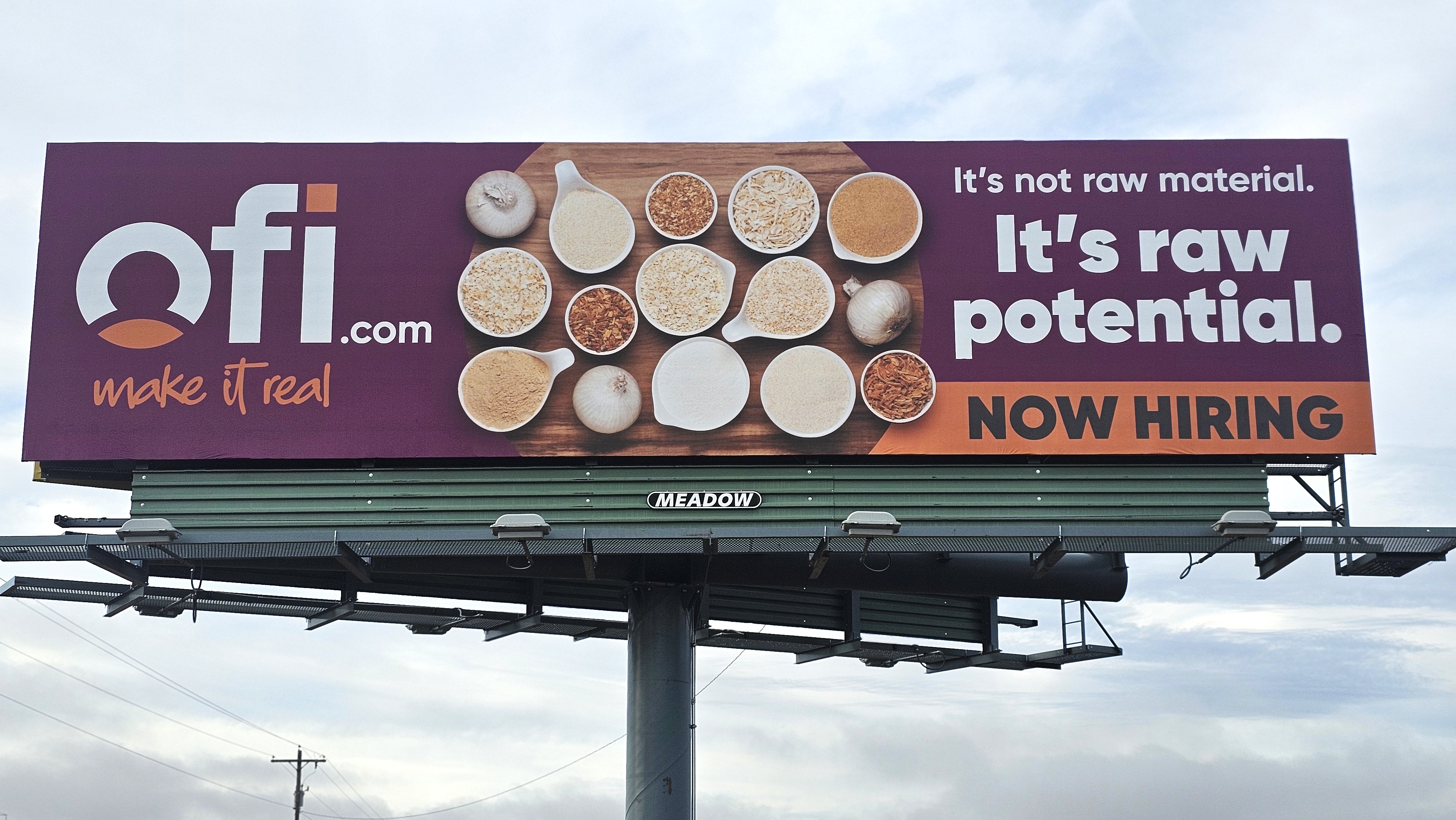 Purple and Orange Billboard for OFI.com that says now hiring