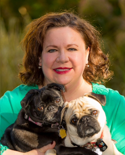 Meadow Outdoor Advertising Salesrep Becky Mendenhall with her two pugs